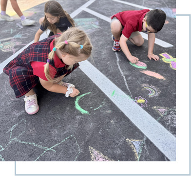students drawing with chalk